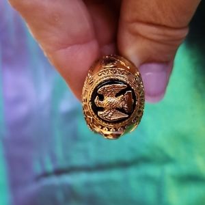 Men's black and gold fashion ring.